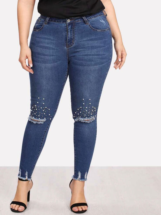 Jean skinny bordures lacérées avec perles